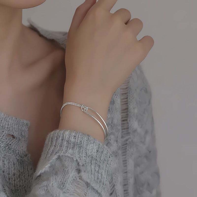 Elegant 925 Sterling Sølv Armbånd med Dobbelt Bue & Knudedetalje